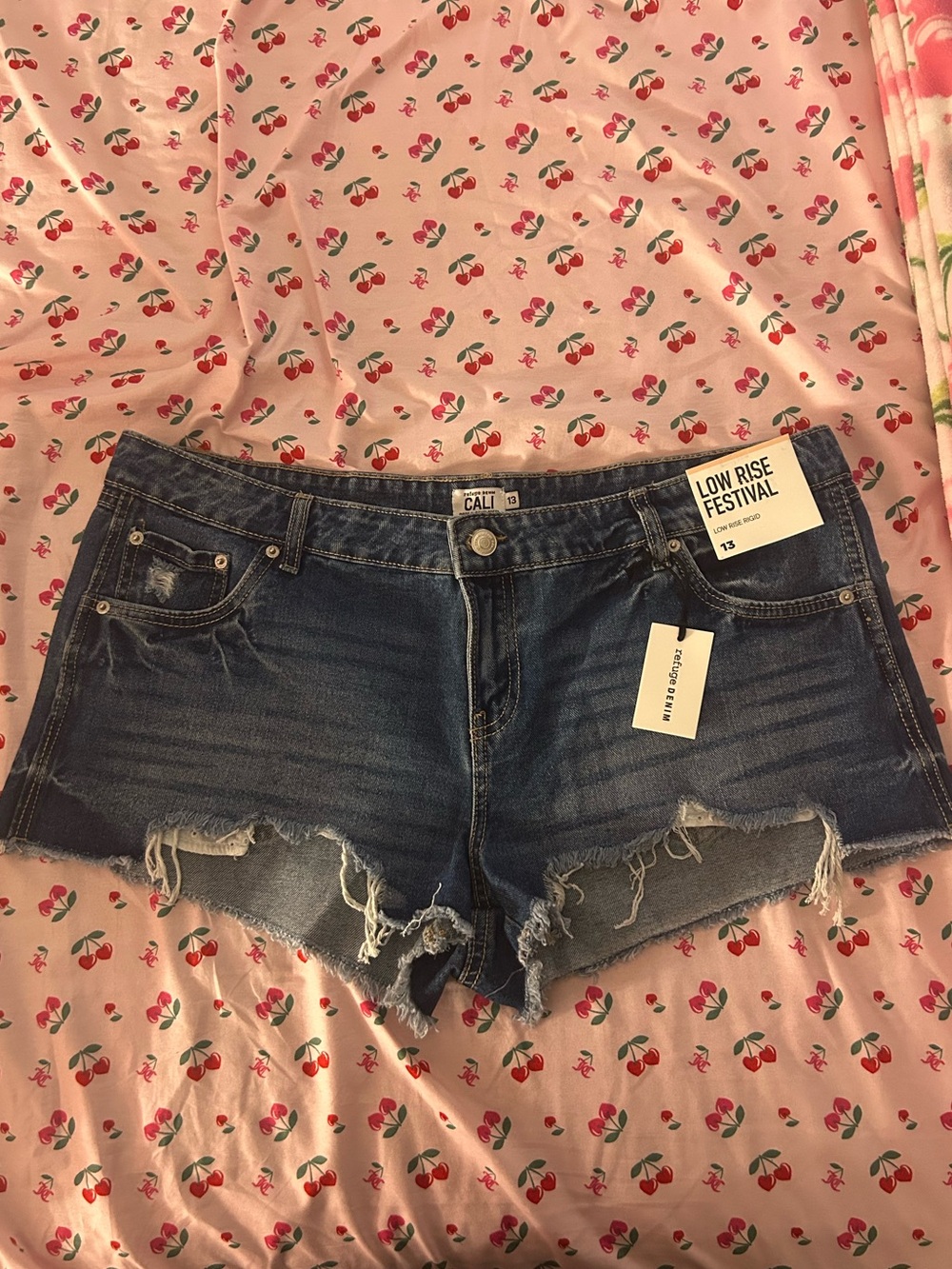 Low-Rise Dark Blue Denim Cutoff Shorts with Distressed Hem